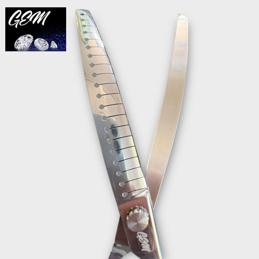 Close-up of GEM Supreme Curved Chunkers 7.5" Scissors made from premium Aichi steel, with one serrated and one smooth blade. The GEM logo with diamond images appears in the top left corner against a dark background.