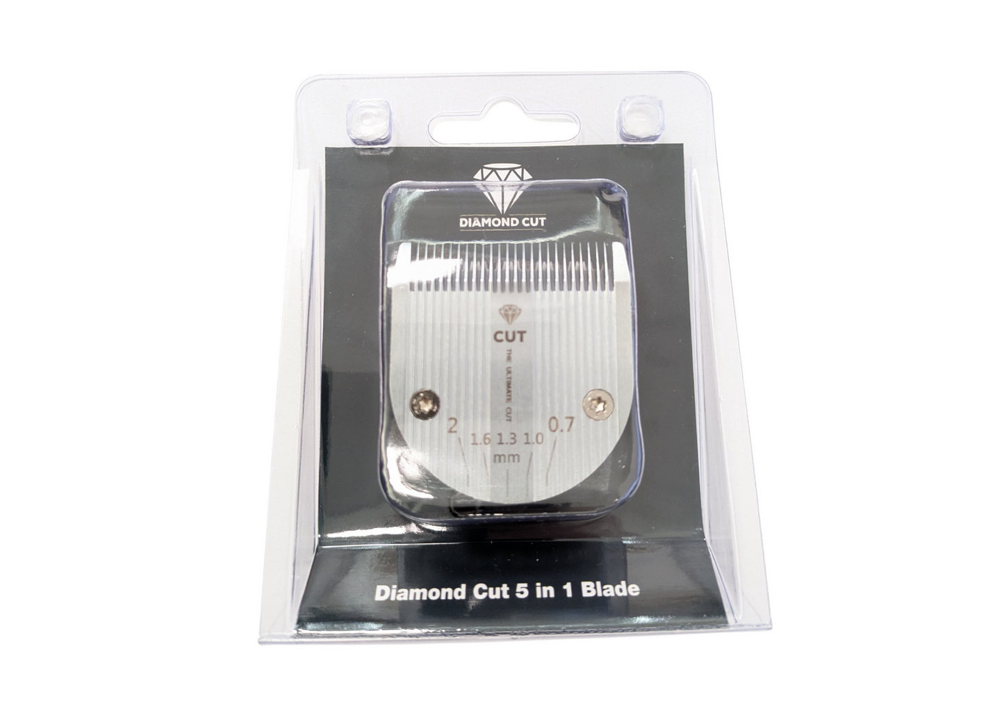 The Diamond Cut 5 in 1 Adjustable Blade (0.7–2mm) with ceramic cutter has silver blades labeled by length, packed in a clear case with black and silver labels. Compatible with DC Medley, Bravura, ARCO, and Supergroom clippers.