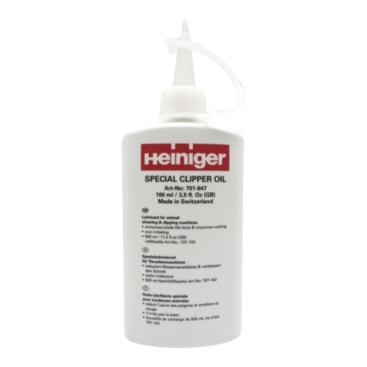 A white bottle of Heiniger Clipper Oil featuring a pointed nozzle cap and a multilingual label stating it is made in Switzerland.