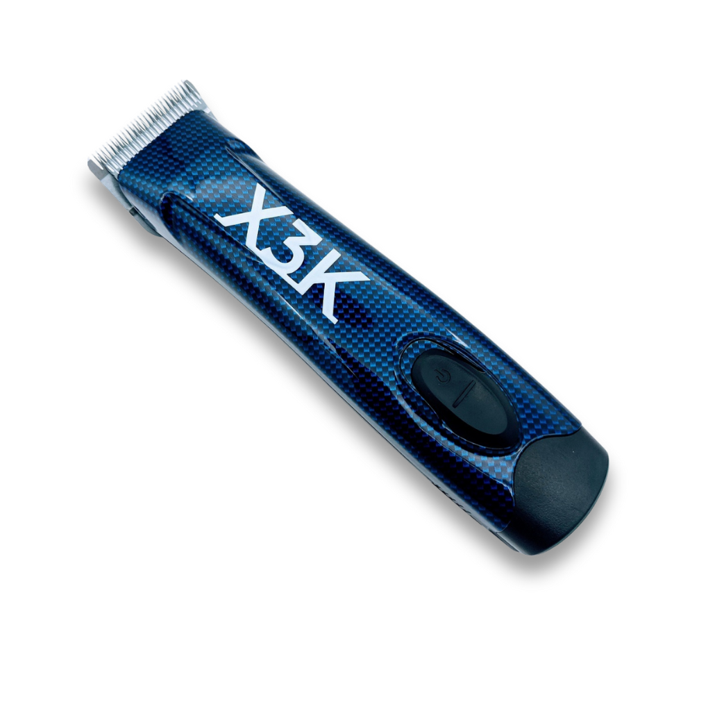 Clipper Servicing: A blue and black X3K electric hair trimmer with a metal blade and on/off switch, displayed on white—perfect for easy maintenance or quick repair.