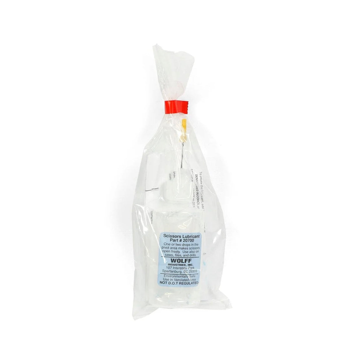 A small plastic bottle of Wolff Industries Scissors Lubricant 1oz inside a clear sealed plastic bag.