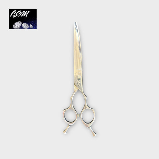 The GEM Supreme Curves 7.5" Scissors, featuring double finger rests and a shiny, professional design, are centered on a light gray background with the GEM logo and gemstone images in the top left corner.