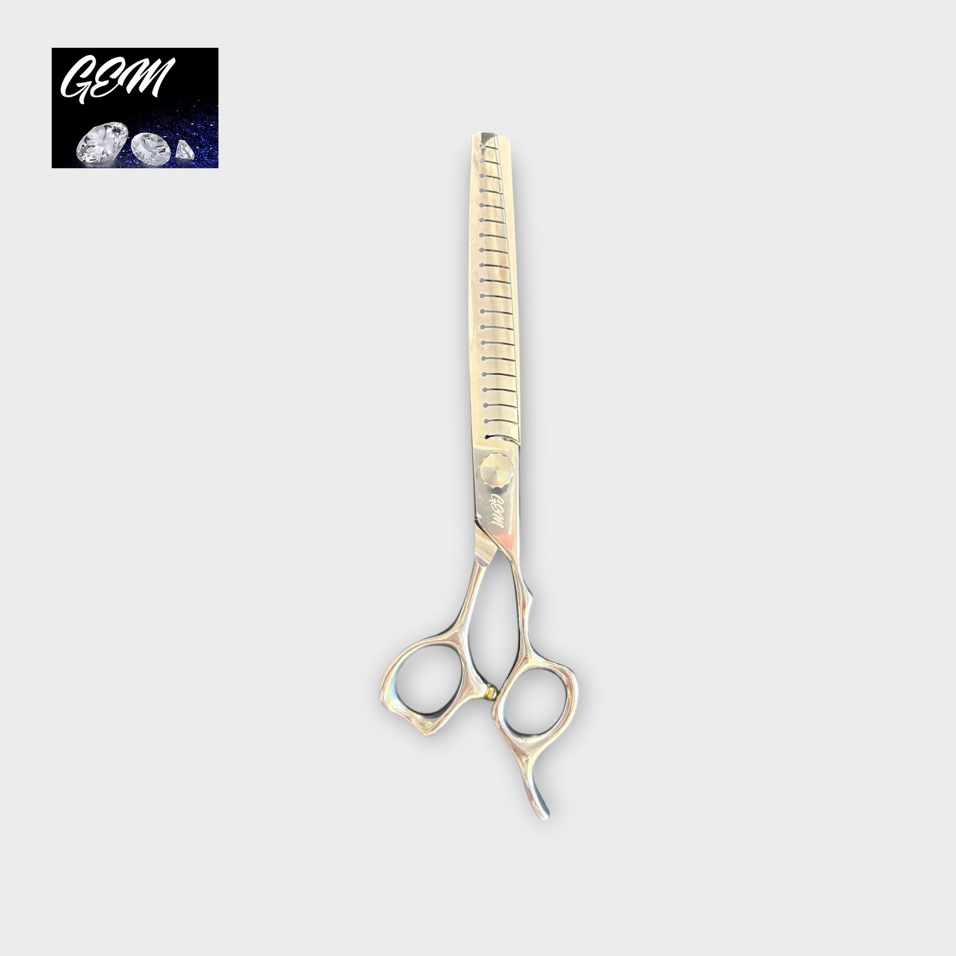 A pair of GEM Supreme Straight Chunkers 7.5" Scissors with a unique handle design is shown on a light gray background. The top left corner features the GEM logo with three gemstones, emphasizing these premium grooming scissors.