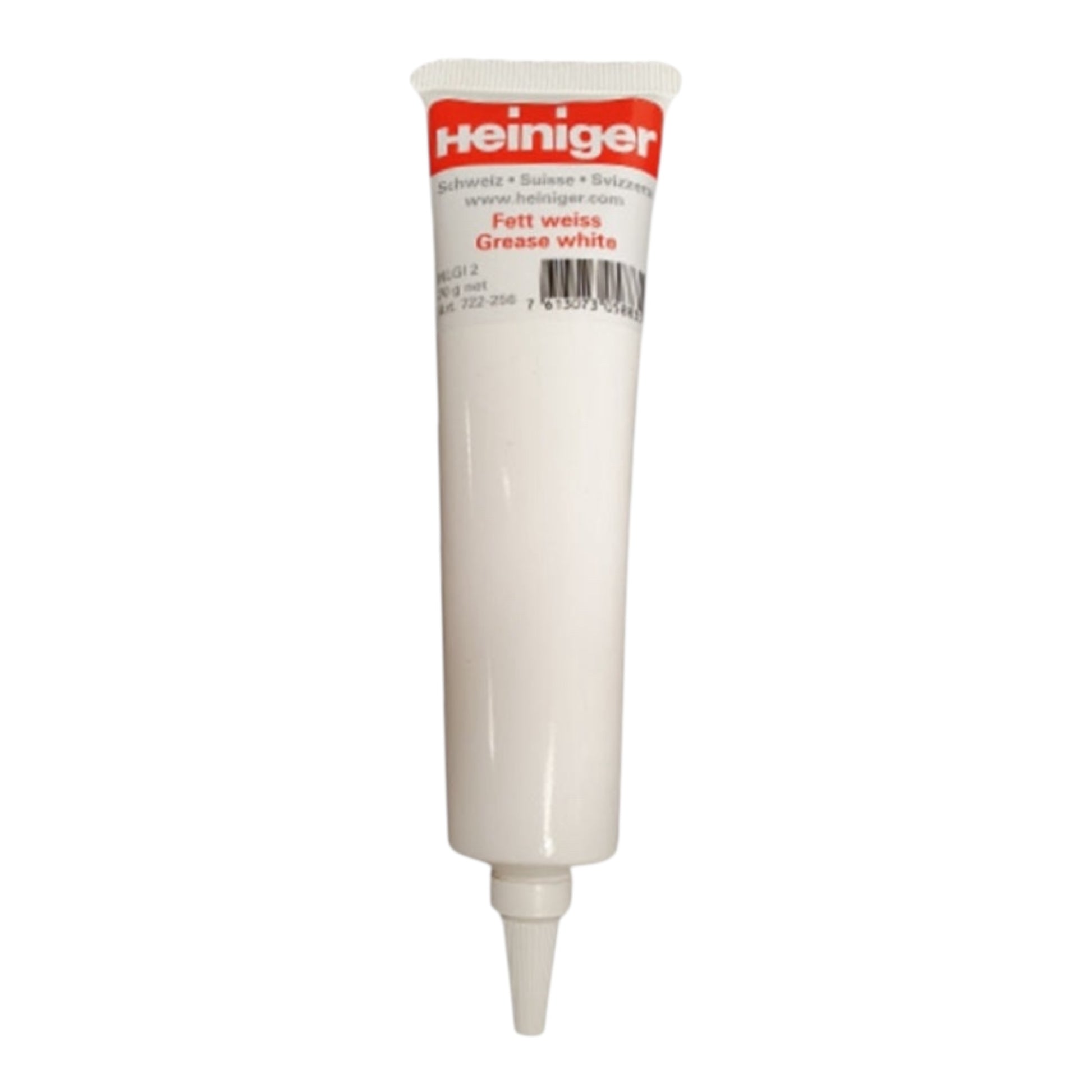 A white tube of Heiniger White Grease with a red and white cap, used for lubrication, is shown standing upright on a white background.