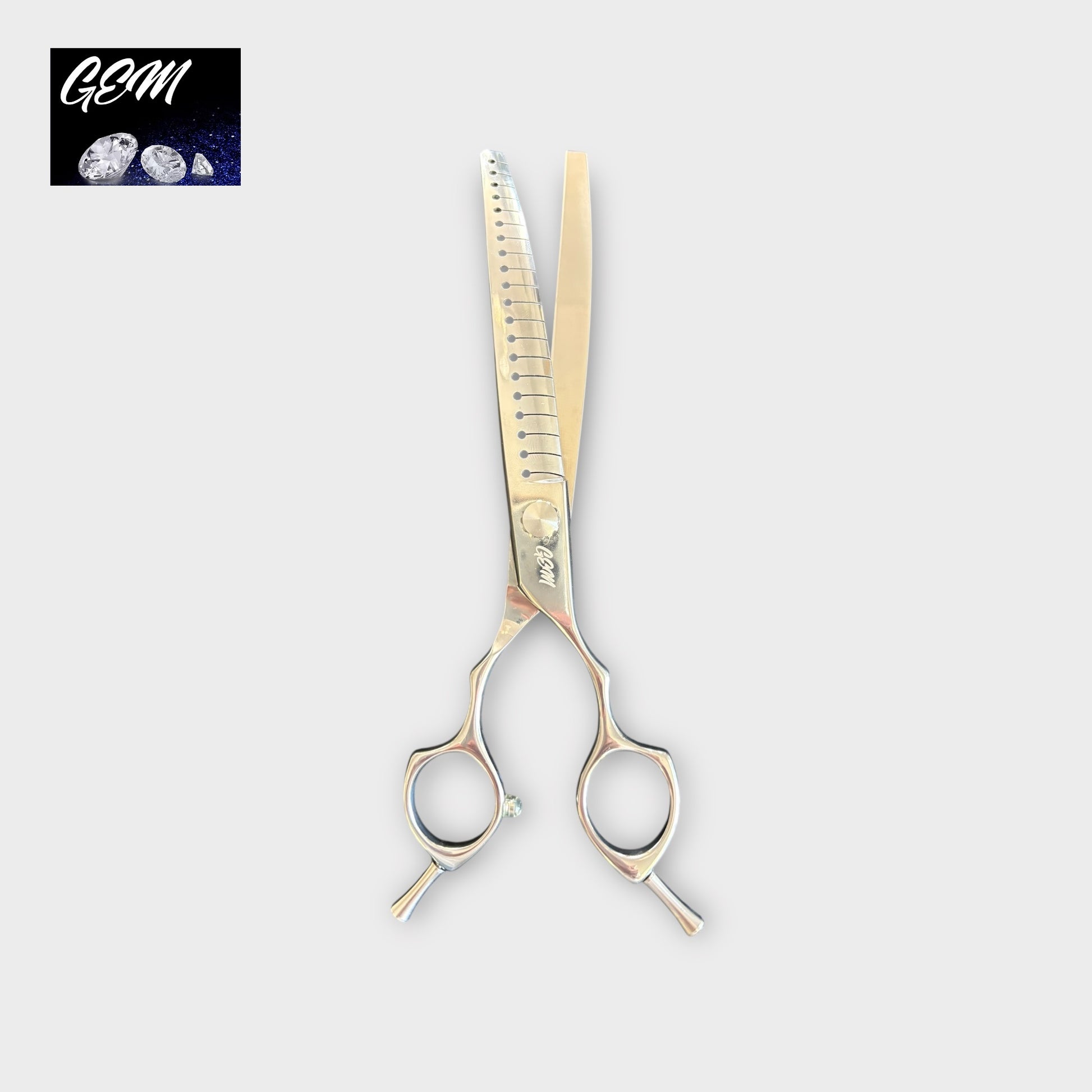 GEM Supreme Curved Chunkers 7.5" scissors, crafted from premium Aichi steel with evenly spaced teeth and an offset handle, are shown on a light gray background. The top left corner features a black rectangular GEM logo with gemstone images.