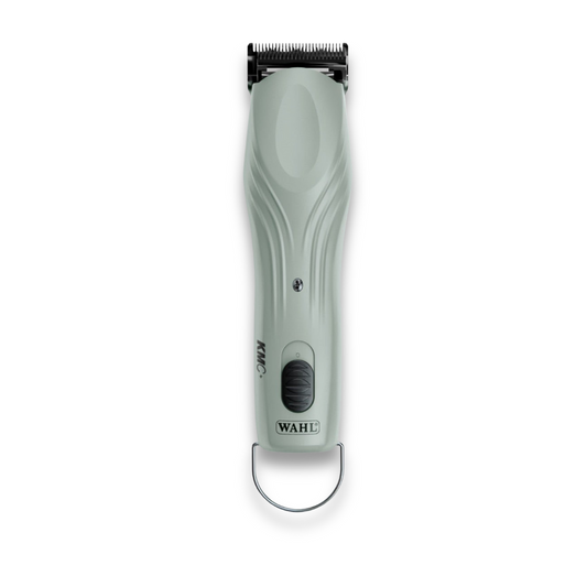 The Clipper Servicing features a cordless Wahl hair trimmer with a light gray ergonomic handle, black power switch, and metal loop—perfect for easy clipper maintenance. Displayed on a white background.